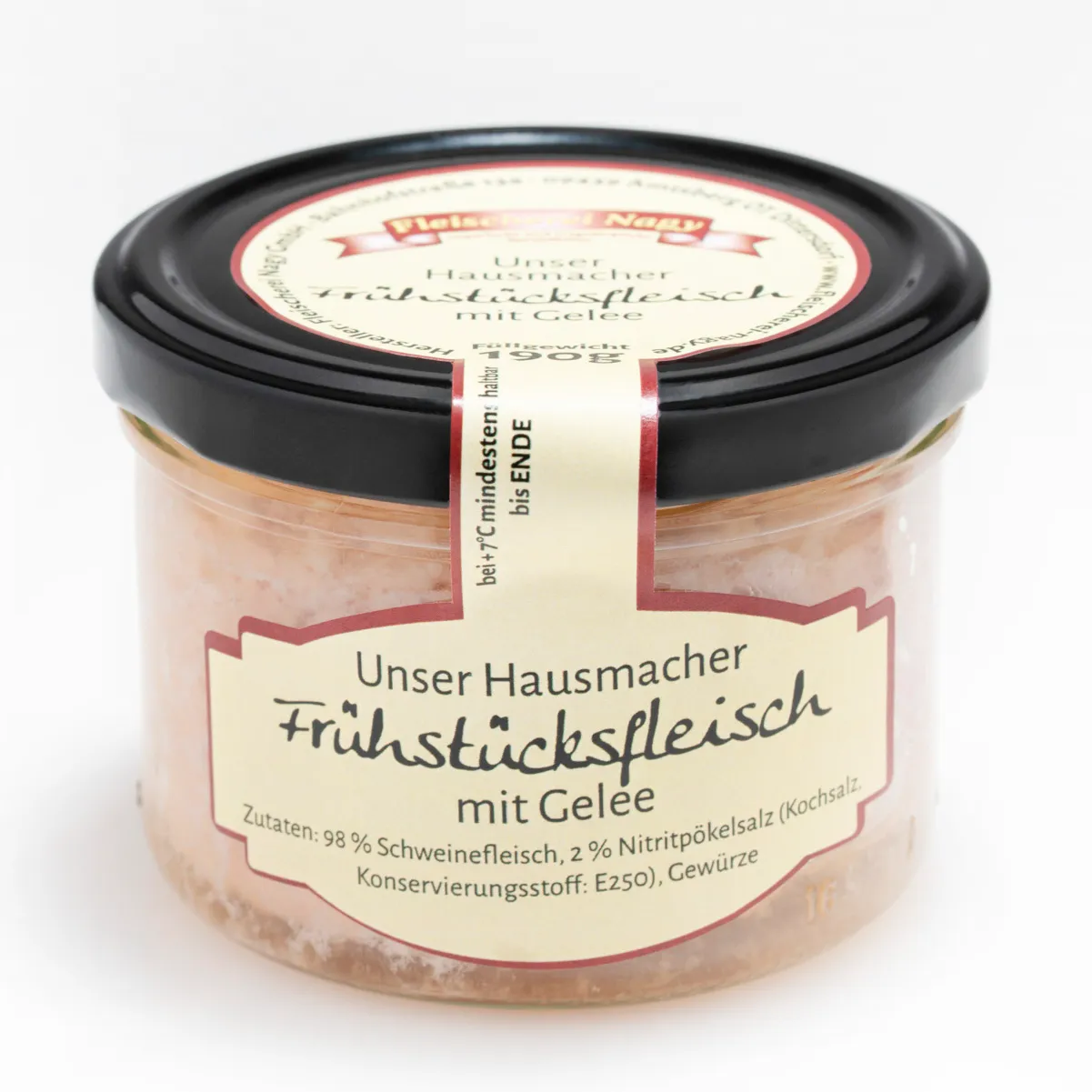 Hausmacher Frühstücksfleisch im Glas auf weißem Hintergrund.
